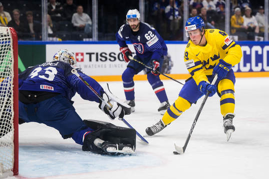 Fabian Zetterlund of Sweden scores 2-0 behind goaltender