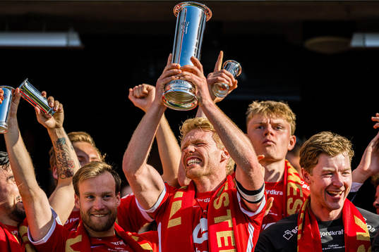 Sivert Heltne Nilsen of Brann celebrates with the trophy