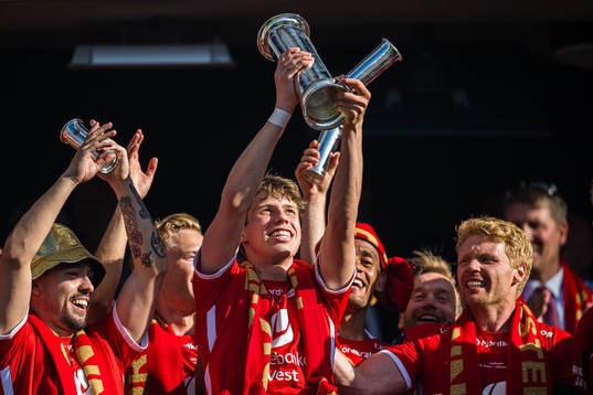 Niklas Jensen Wassberg of Brann celebrates with the trophy