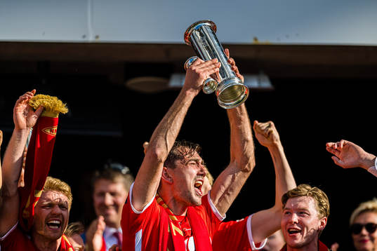 Fredrik Pallesen Knudsen of Brann celebrates with the trophy