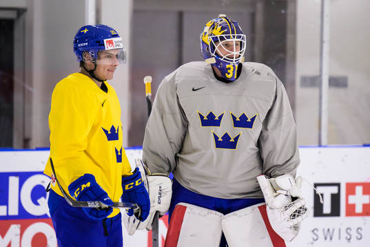 André Petersson and goaltender Lars Johansson of Sweden at