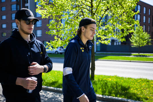 Goaltender Jesper Wallstedt and Leo Carlsson of Sweden walk