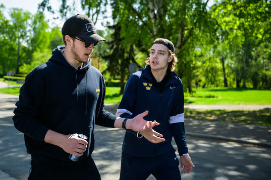 Goaltender Jesper Wallstedt and Leo Carlsson of Sweden walk