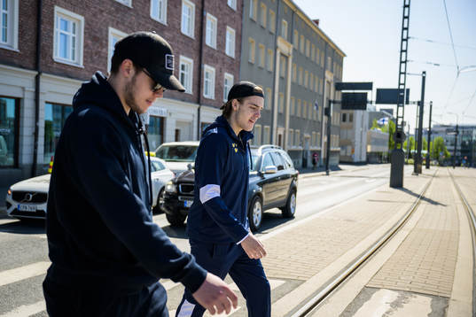 Goaltender Jesper Wallstedt and Leo Carlsson of Sweden walk