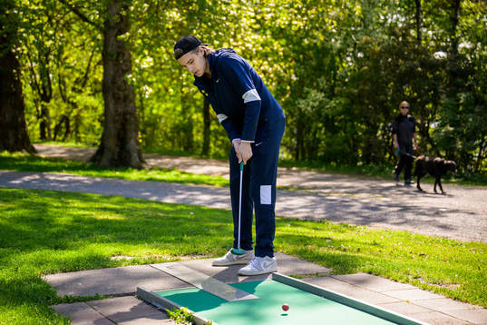 Leo Carlsson of Sweden plays minigolf