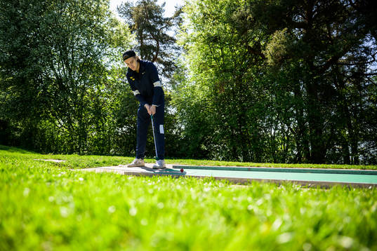 Leo Carlsson of Sweden plays minigolf