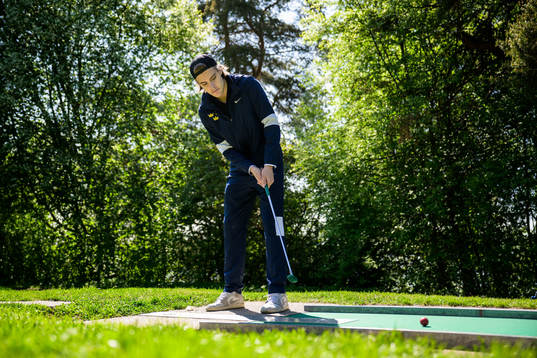 Leo Carlsson of Sweden plays minigolf