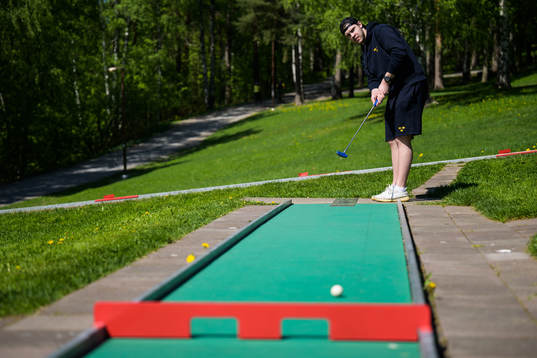Goaltender Jesper Wallstedt of Sweden plays minigolf
