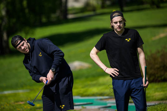 Goaltender Jesper Wallstedt and Leo Carlsson of Sweden play