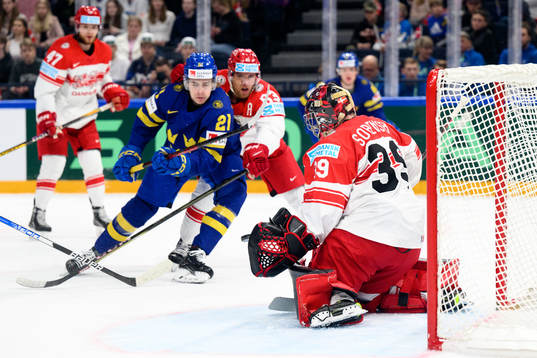 Goaltender George Sørensen of Denmark saves a shot from