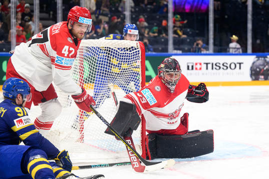 Carl Grundström of Sweden with Oliver Larsen and