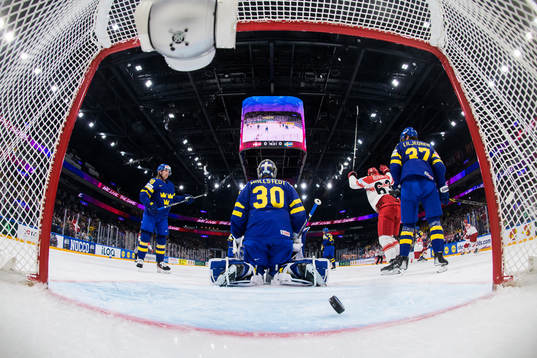 Goaltender Jesper Wallstedt of Sweden lets in the 1-0 goal