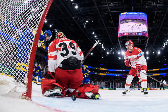 André Petersson of Sweden scores 1-2 behind goaltender