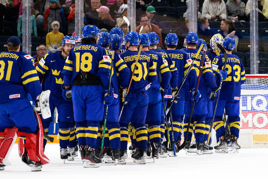 The Swedish players celebrate