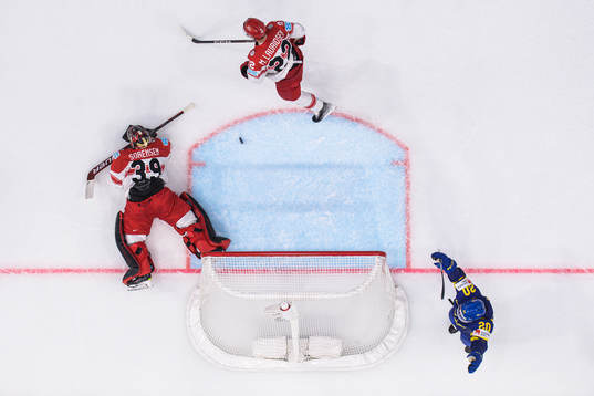 Goaltender George Sørensen and Markus Lauridsen of Denmark