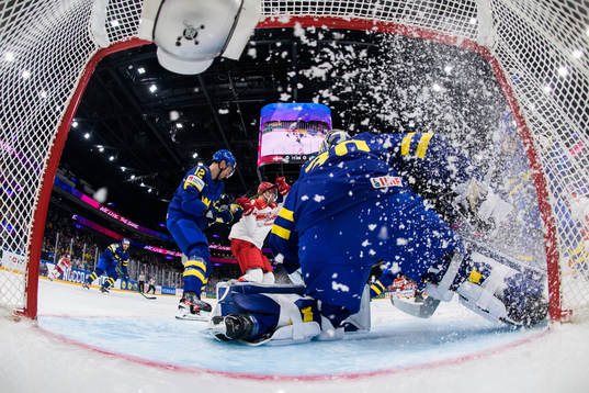 Patrik Nemeth and goaltender Jesper Wallstedt of Sweden