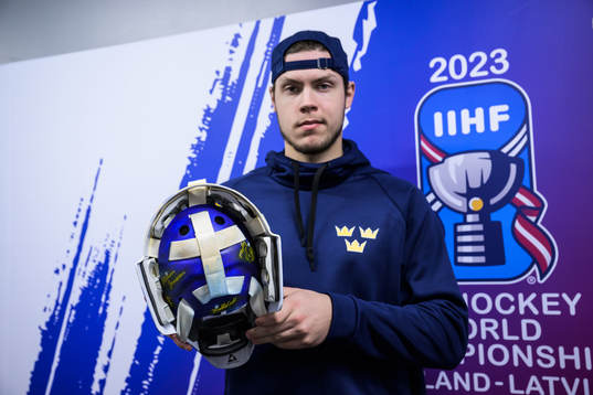 Goaltender Jesper Wallstedt of Sweden poses with his helmet