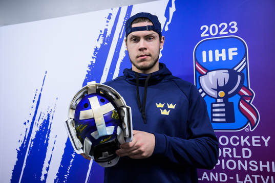 Goaltender Jesper Wallstedt of Sweden poses with his helmet