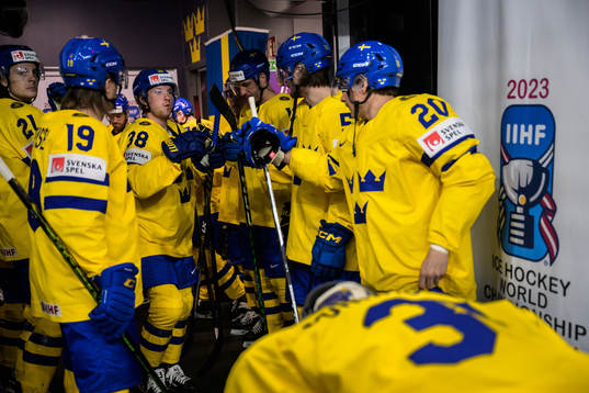 Rasmus Sandin of Sweden fist bump with teammates