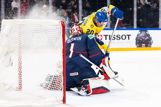 Goaltender Casey Desmith of USA and André Petersson of