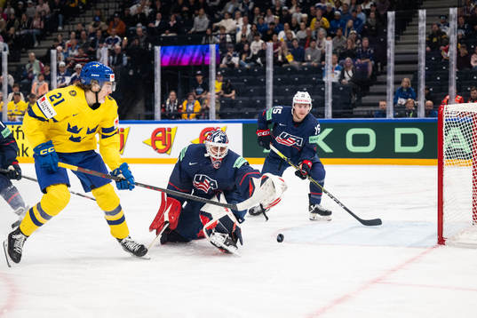 Leo Carlsson of Sweden infront of goaltender Casey Desmith
