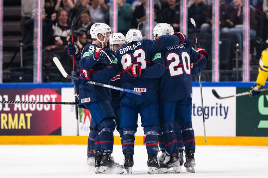 Conor Garland of USA celebrates with team mates