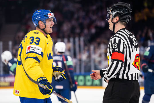 Jakob Silfverberg of Sweden reacts to linesman Andre