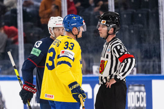 Nick Bonino of USA and Jakob Silfverberg react to linesman