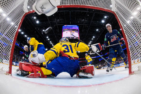 Conor Garland of USA scores 1-2 behind goaltender Lars
