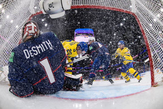Goaltender Casey Desmith of USA and André Petersson of