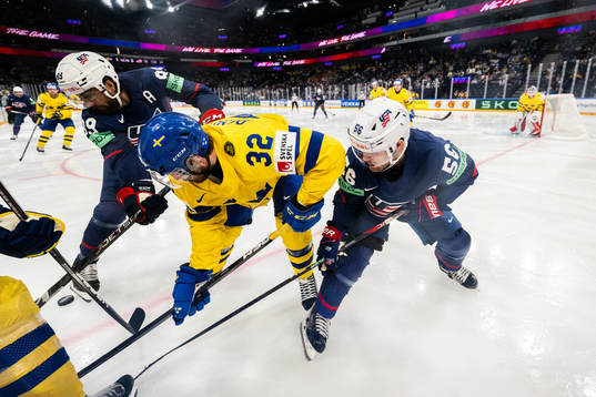 Alex Tuch and Rocco Grimaldi of USA against Lukas Bengtsson