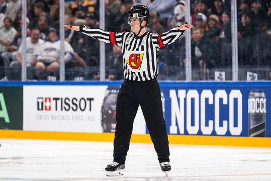 Linesman Andre Schrader shows no goal decision