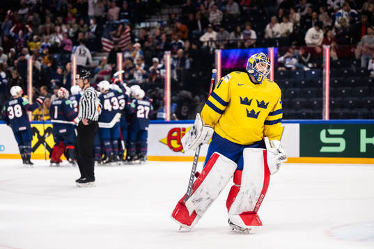 Goaltender Lars Johansson of Sweden looks dejected