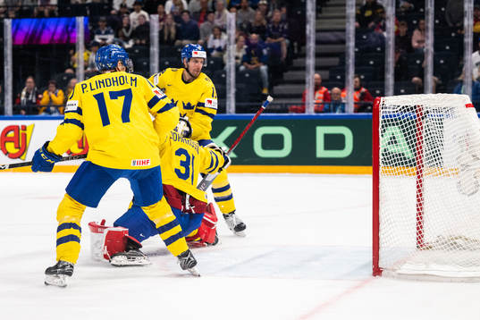 Pär Lindholm, goaltender Lars Johansson and Patrik Nemeth