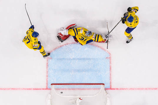 Pär Lindholm, goaltender Lars Johansson and Patrik Nemeth