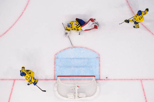 Pär Lindholm, goaltender Lars Johansson and Patrik Nemeth