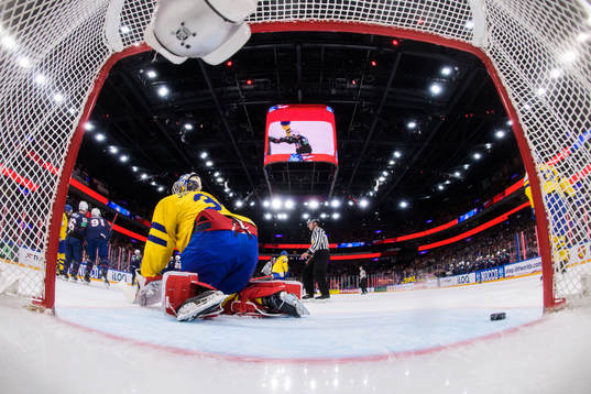 Goaltender Lars Johansson of Sweden looks dejected
