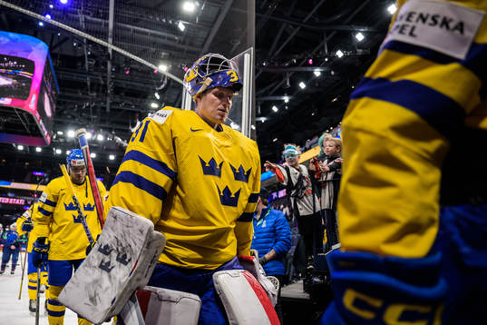 Goaltender Lars Johansson of Sweden looks dejected as he