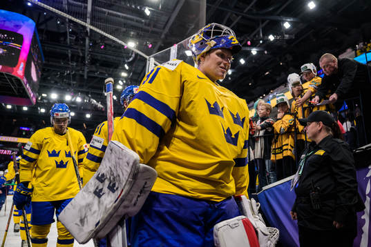Goaltender Lars Johansson of Sweden looks dejected as he