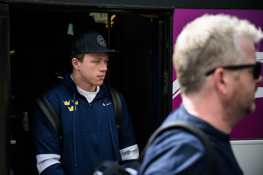 Lucas Raymond of Sweden leaves a bus when traveling from