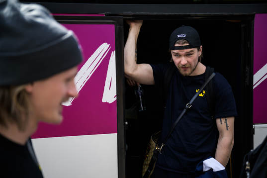 Linus Johansson of Sweden leaves a bus when traveling from