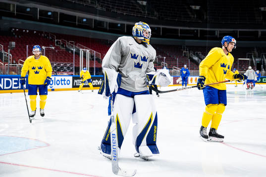 goaltender Jesper Wallstedtand Jakob Silfverberg of Sweden