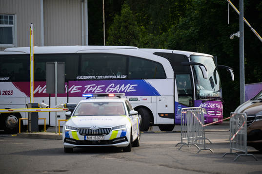 The team bus of Sweden arrives to the arena with a police