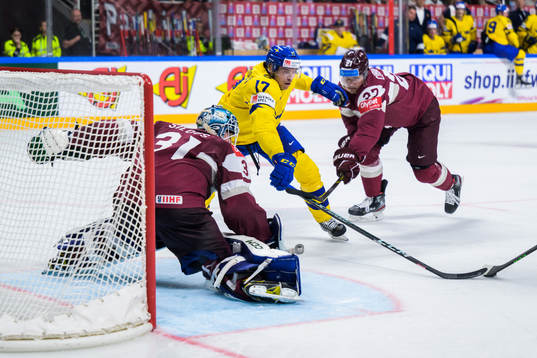 goaltender Arturs Silovs and Oskars Cibulskis of Latvia