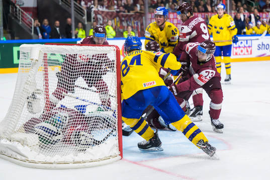 goaltender Arturs Silovs and Deniss Smirnovs of Latvia