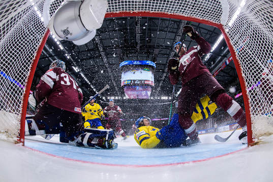 Goaltender Arturs Silovs and Kristians Rubins of Latvia are