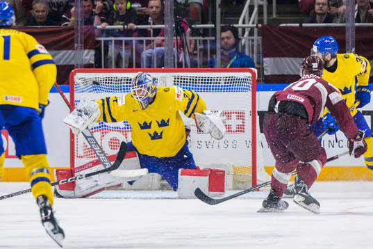 goaltender Lars Johansson of Sweden concedes 1-2 from Miks