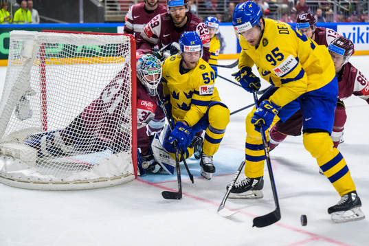 goaltender Arturs Silovs, Ralfs Freibergs and Dans Locmelis