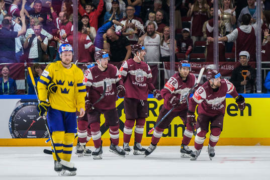 Carl Grundström of Sweden looks dejected while Rihards