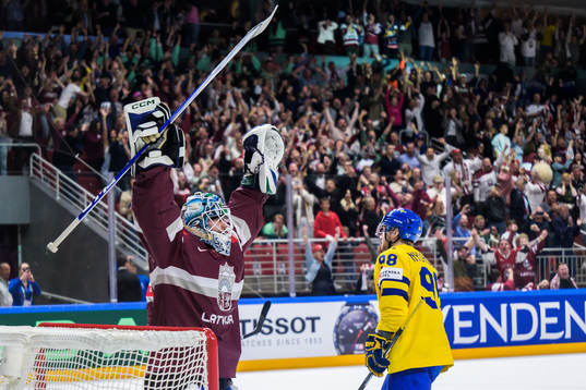 goaltender Arturs Silovs of Latvia celebrates as Alexander